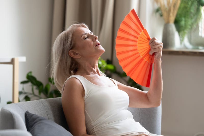 woman fanning herself
