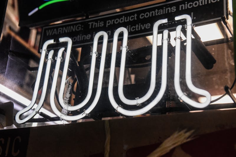 A sign advertising Juul products is displayed in a store on December 19, 2019 in New York City.