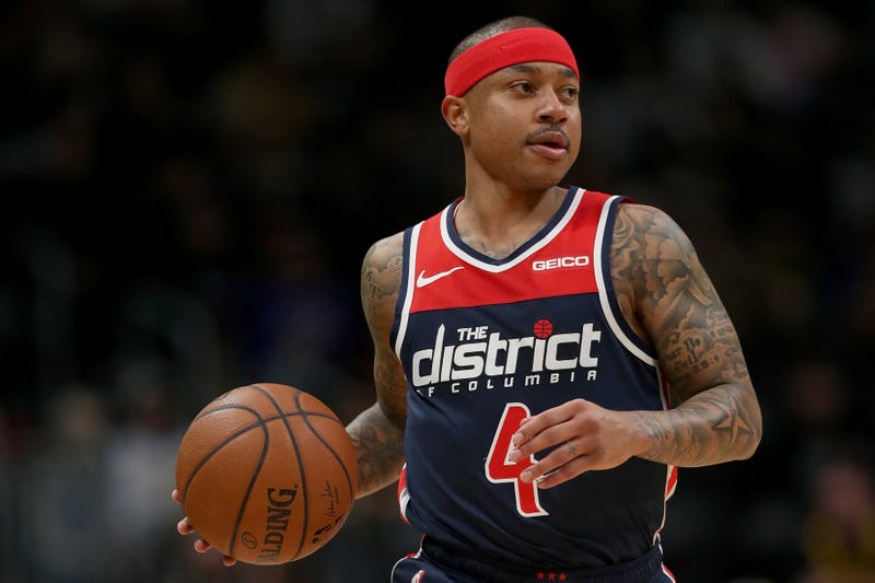 Former Wizards guard Isaiah Thomas dribbles the ball.