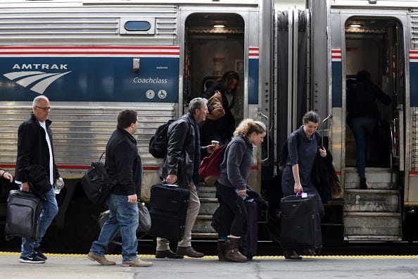 Amtrak train with passengers boarding.