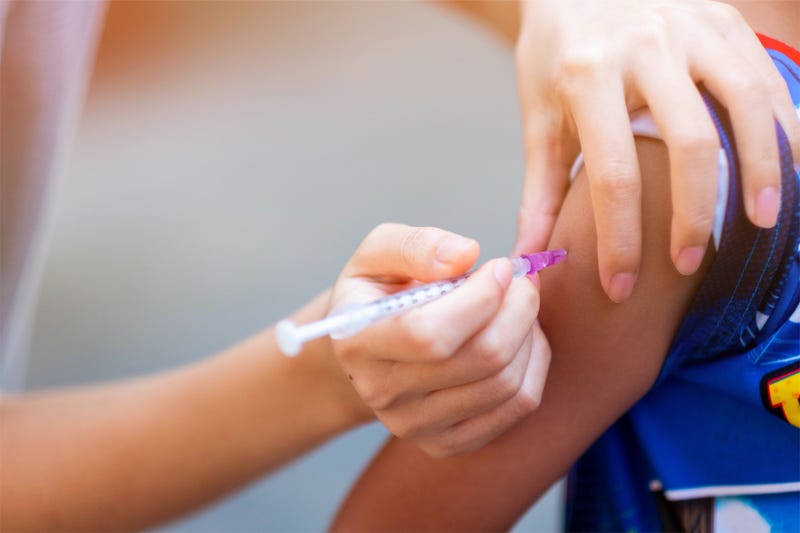 Child gets vaccination shot