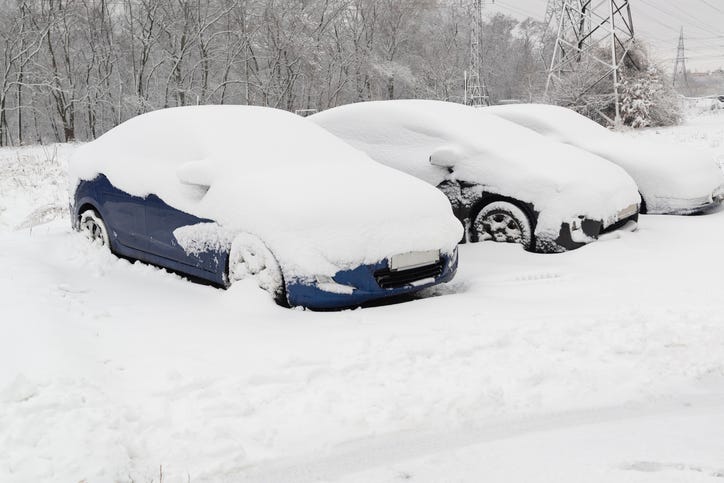 Cars covered in snow