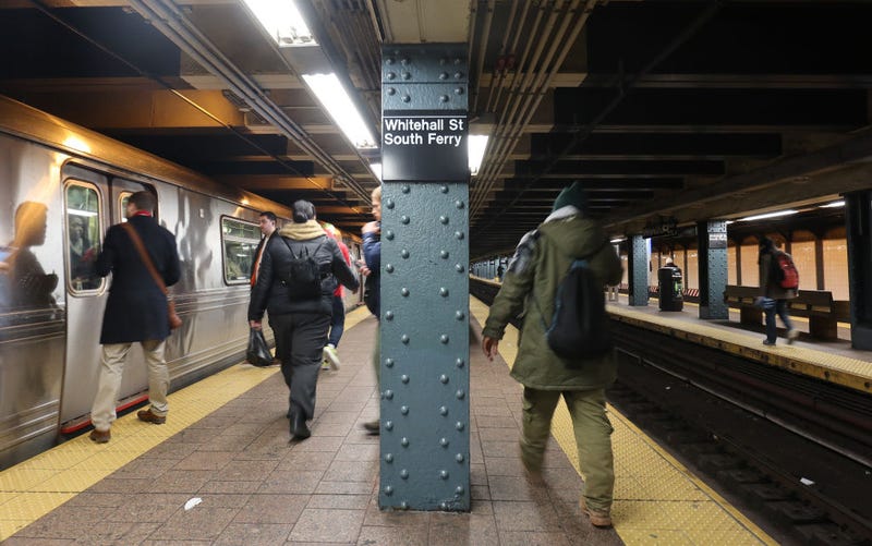 People walk through the Whitehall Street-South Ferry subway station on Dec.  3, 2019 in New York City.