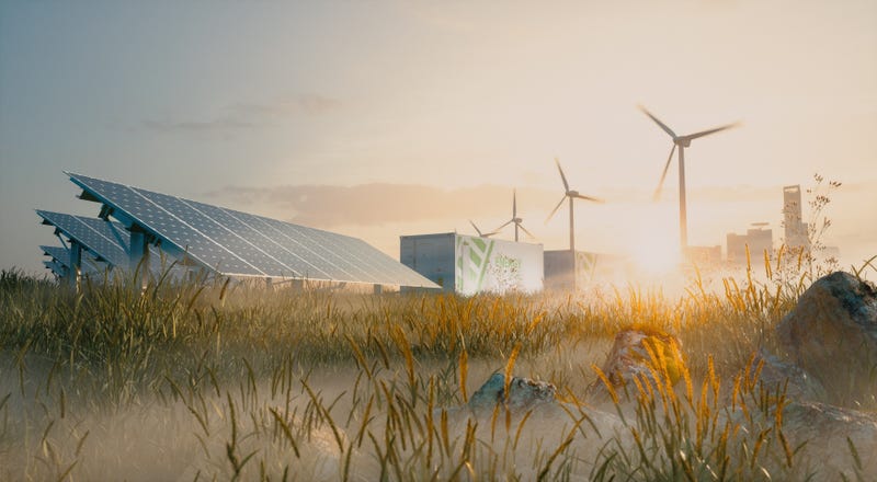 Concept of renewable energy solution in beautiful morning light. Installation of solar power plant, container battery energy storage systems, wind turbine farm and city in background.