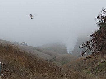  In this handout photo provided by the Los Angeles Sheriff’s Department, emergency crews respond to a helicopter crash that reportedly killed former NBA player Kobe Bryant on January 26, 2020 in Calabasas, California.