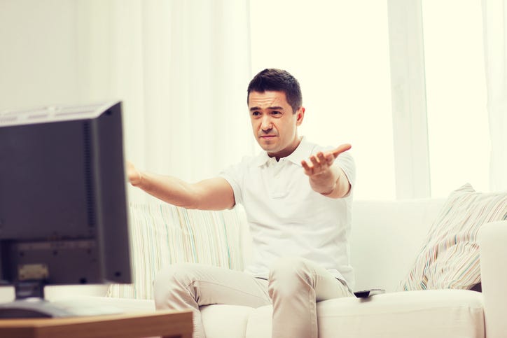 Disappointed Man Watching TV