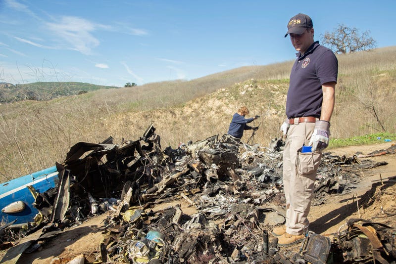 In this handout photo provided by the National Transportation Safety Board, investigators work at the scene of the helicopter crash that killed former NBA star Kobe Bryant and his 13-year-old daughter Gianna on January 27, 2020 in Calabasas, California. All nine people on board, including the pilot, died in the crash.