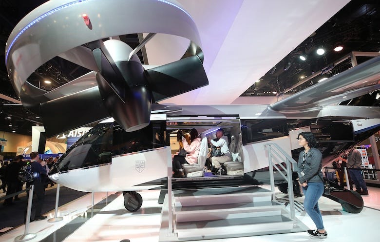 Attendees visit a full-scale mockup of the Bell Nexus 4EX air taxi concept at CES 2020 at the Las Vegas Convention Center on January 8, 2020 in Las Vegas, Nevada