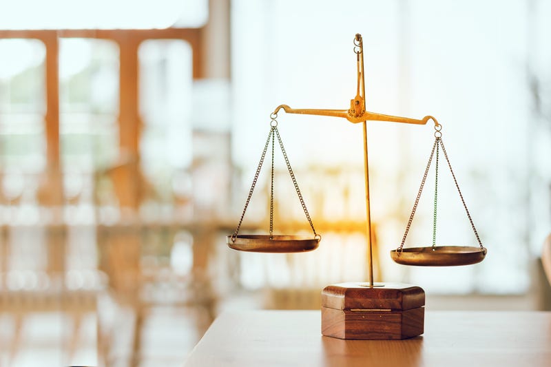 Symbol of law and scales of justice in a legal office.