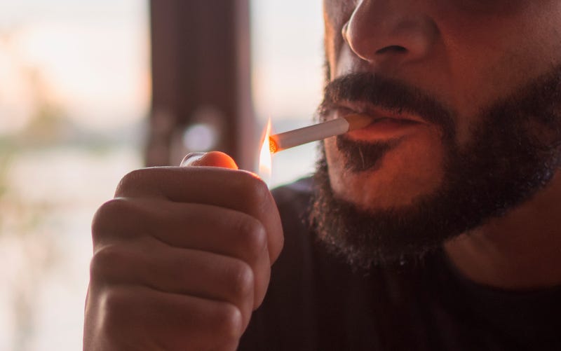 A man smoking.