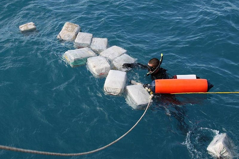 In this handout provided by U.S. Coast Guard, he crew of the Coast Guard Cutter Seneca interdicts a drug smuggling, self-propelled semi-submersible (SPSS) vessel carrying cocaine on an unspecified date in the western Caribbean Sea. It was the first interdiction of an SPSS in the Caribbean. (Photo by U.S. Coast Guard via Getty Images)