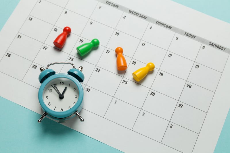 alarm clock on a monthly calendar