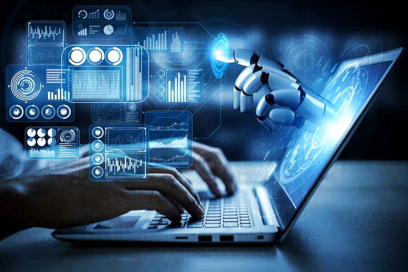 robot hand reaches out of laptop screen
