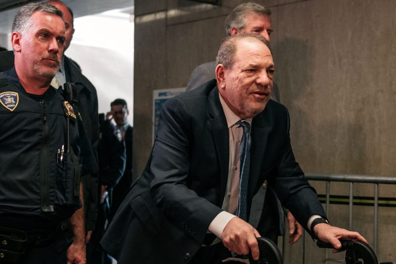 Movie producer Harvey Weinstein (R) enters New York City Criminal Court on February 24, 2020 in New York City