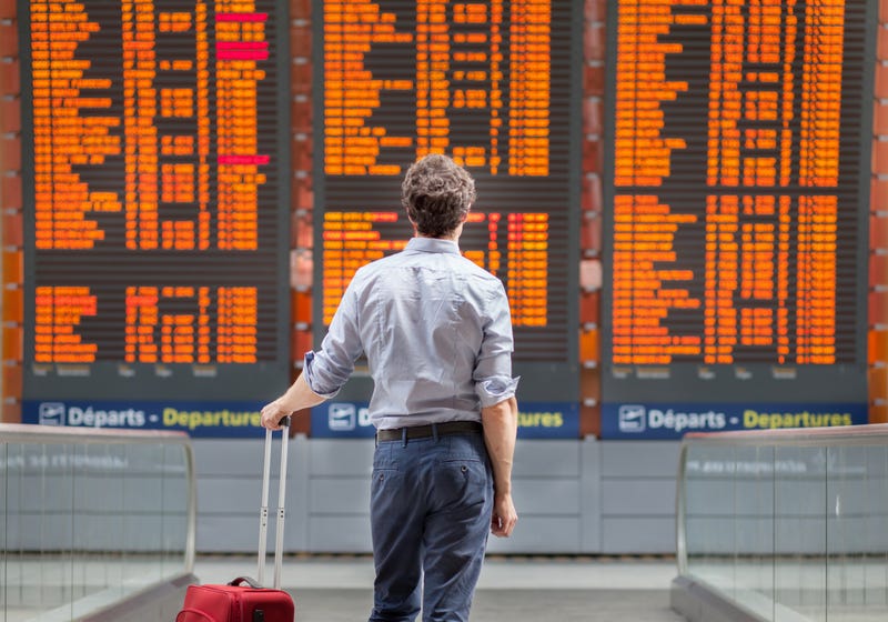 travel with international flight, person passenger waiting in airport departure terminal