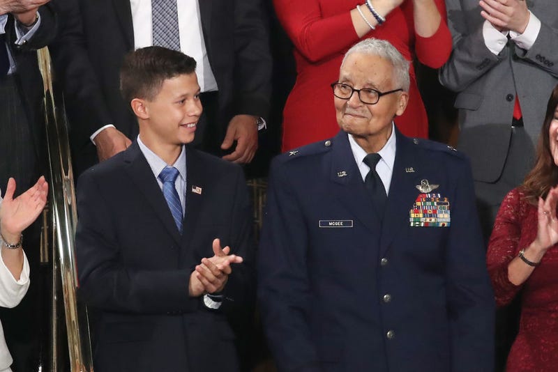 Retired U.S. Air Force Col. Charles McGee, who served with the Tuskegee Airmen, attends the State of the Union address with his great- grandson Iain Lanphier.