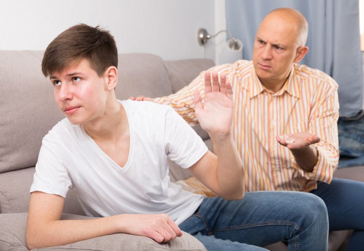 Father scolding son