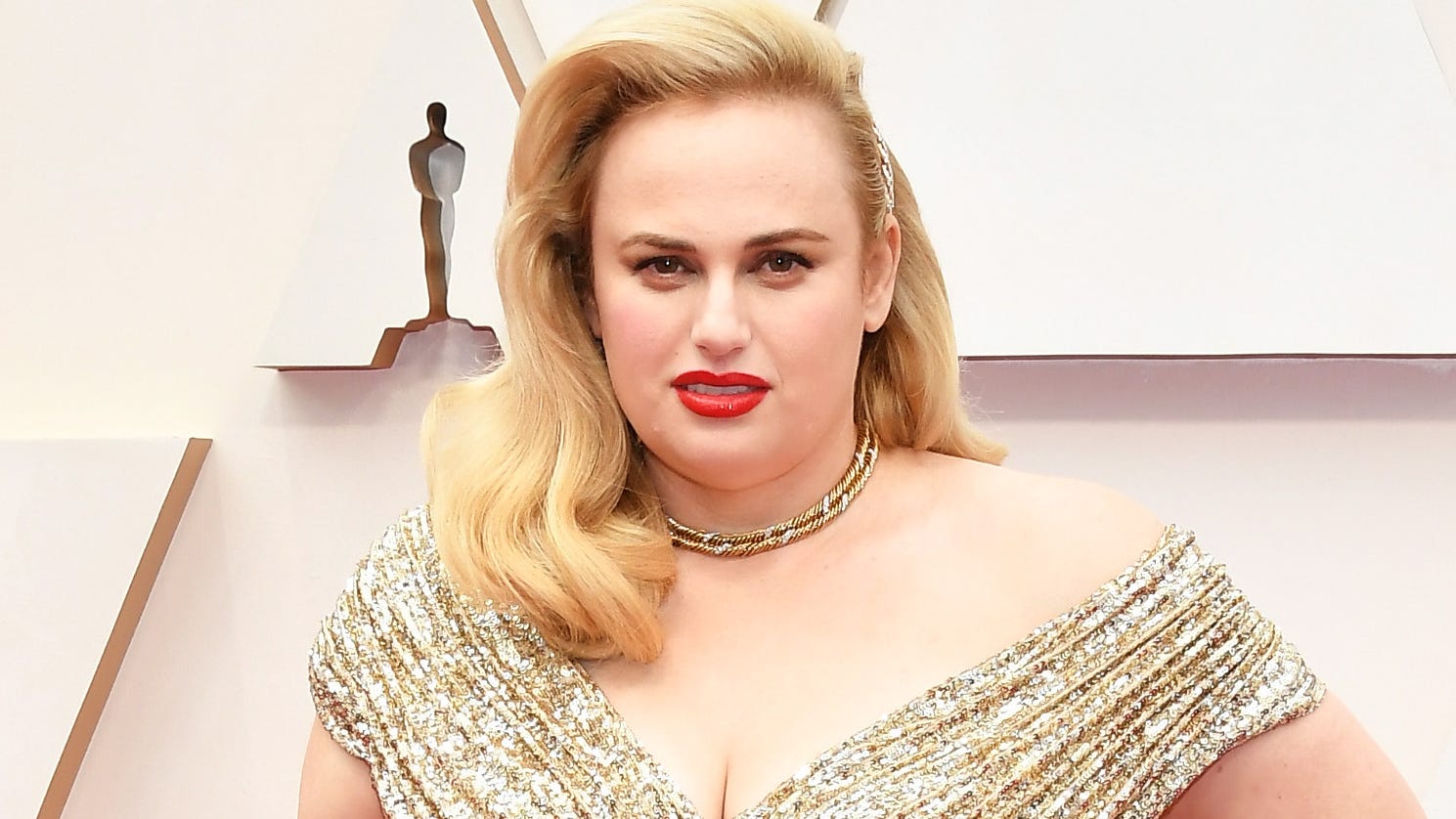 Rebel Wilson flaunts physique in fiery form-fitting red jumpsuit