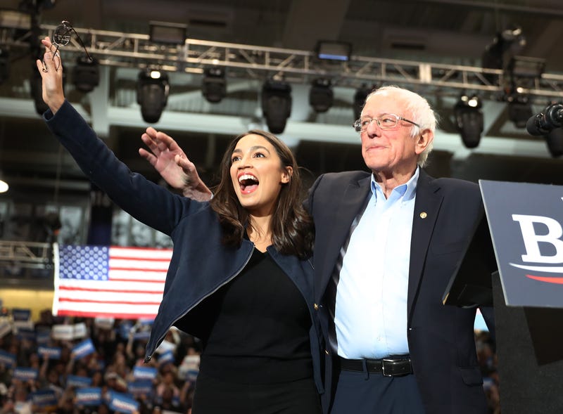 Bernie Sanders and Alexandria Ocasio-Cortez at a rally during Sanders' 2020 election campaign.
