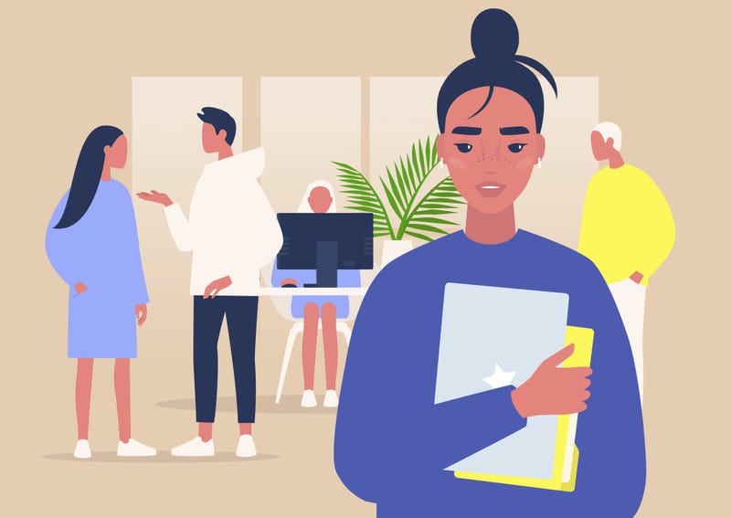 A portrait of a young female manager holding a laptop and folders.