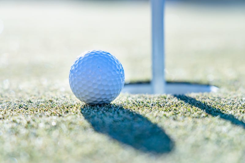 Green golf course on a sunny winter day