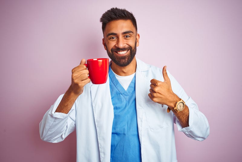Doctor holding a cup of coffee.