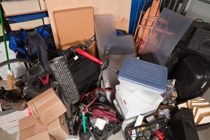 Storage pile of sporting gear, music equipment, suitcases, files, boxes and more