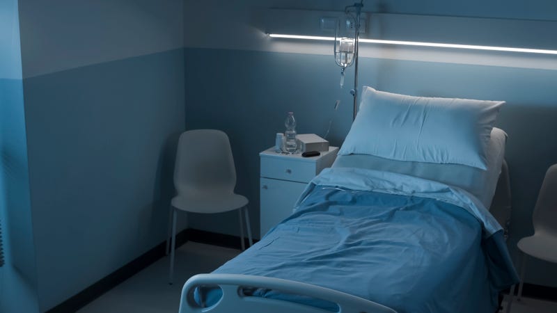 Bed in dark hospital room