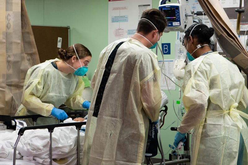  In this handout released by the U.S. Navy, Sailors assigned to the hospital ship USNS Mercy (T-AH 19) treat the first patient from Los Angeles medical facilities March 29.