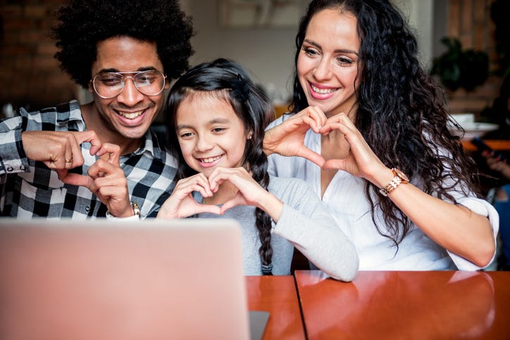 Family Using A Laptop Together