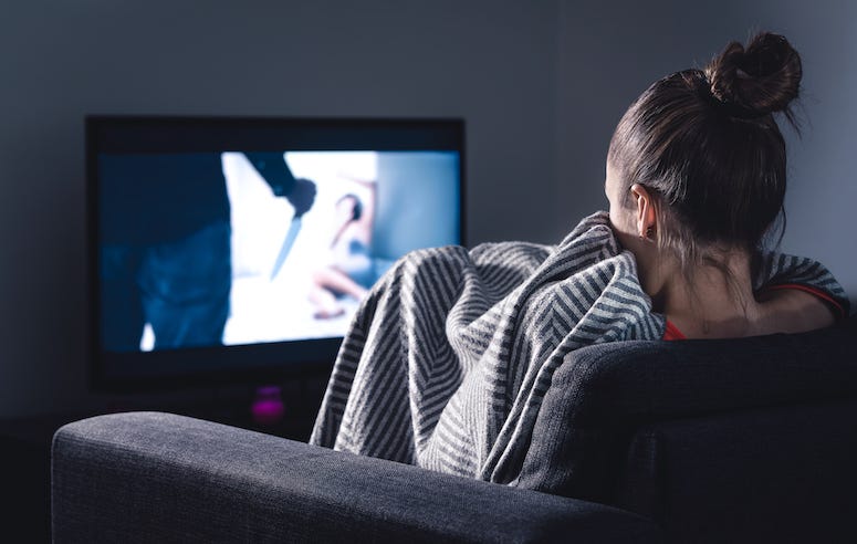 Woman scared watching movie