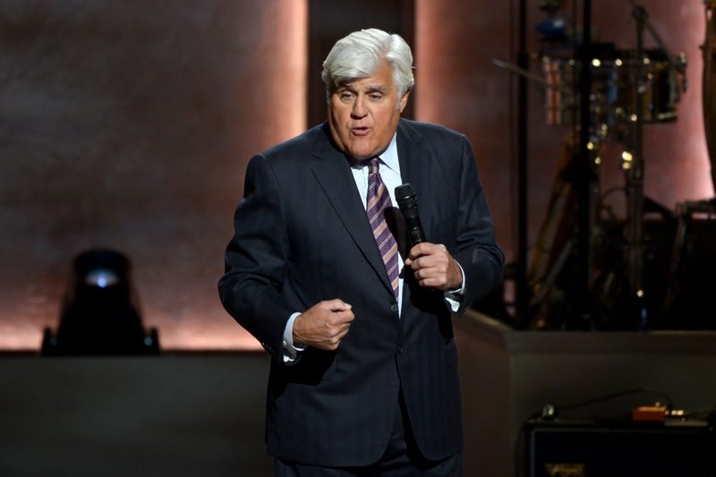 jay leno speaking into a microphone