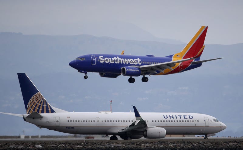 A Southwest Airlines plane lands next to a United Airlines plane at San Francisco International Airport on March 06, 2020 in Burlingame, California.