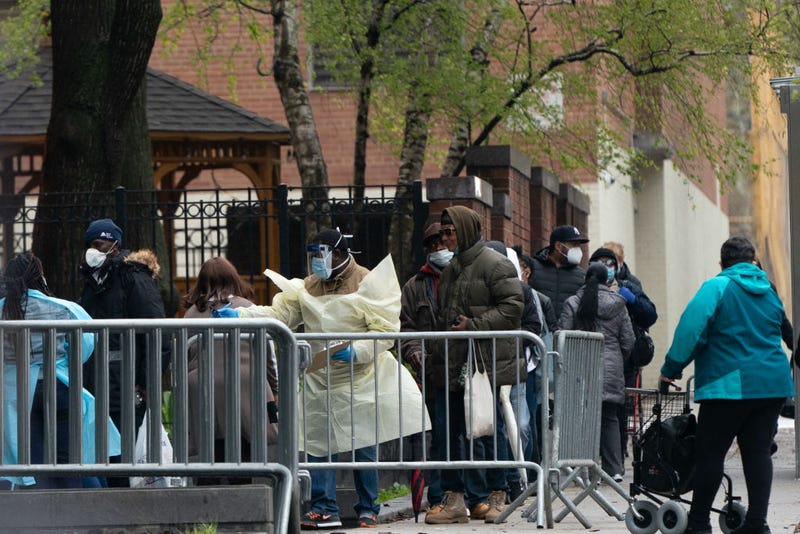 People wait in line to be tested for the coronavirus outside Gouverneur Health Center on April 24, 2020, in New York City.
