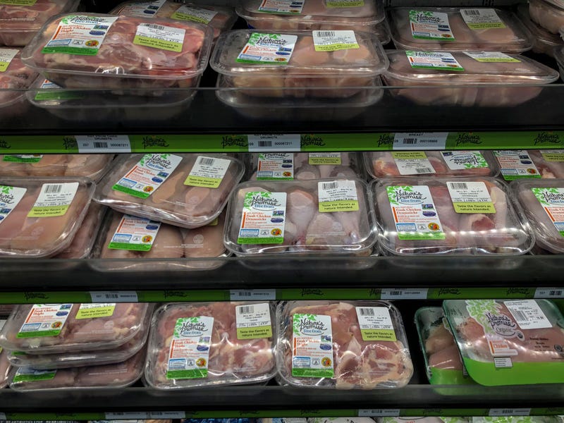 Chicken sits on the shelf at a grocery store, April 28, 2020 Washington, DC. Meat industry experts say that beef, chicken and pork could become scarce in the United States because many meat processing plants have been temporarily closed down due to the coronavirus pandemic.
