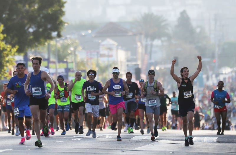FILE - Runners participate in the Los Angeles Marathon, which was allowed to continue by health officials in spite of coronavirus COVID-19 fears, on March 8, 2020 in Los Angeles.