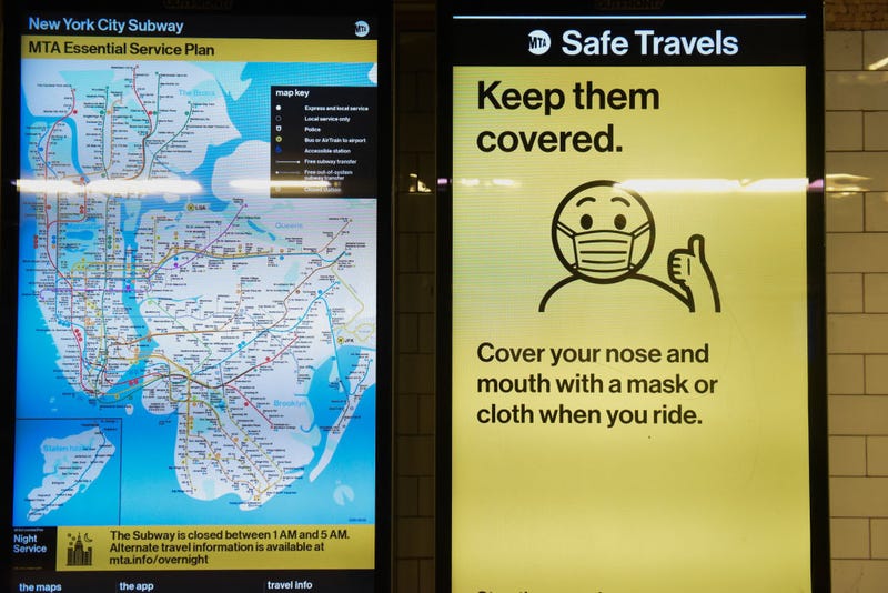 A sign in the subway system asks people to wear a protective mask while riding on a subway on May 6, 2020 in Manhattan in New York City.