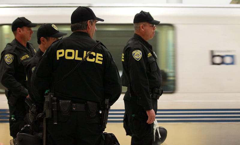 Bay Area Rapid Transit (BART) police officers stand on the platform at the Civic Center station on August 15, 2011 in San Francisco, California.