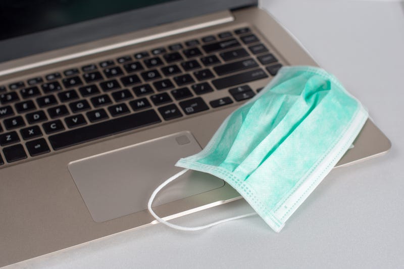 Medical breathing mask on laptop