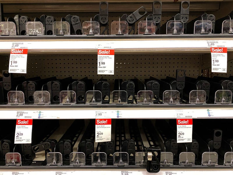 Shelves normally stocked with pasta sauses sit empty