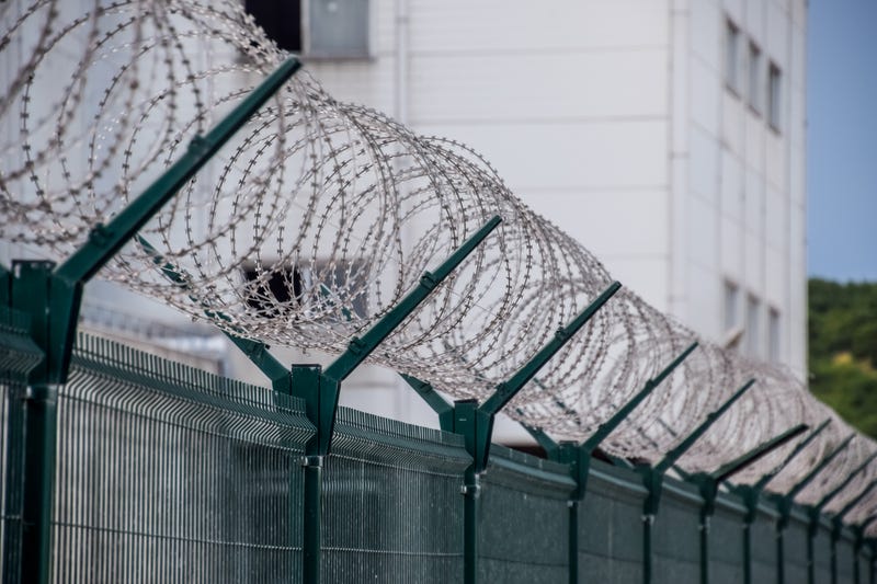 barbed wire prison fence