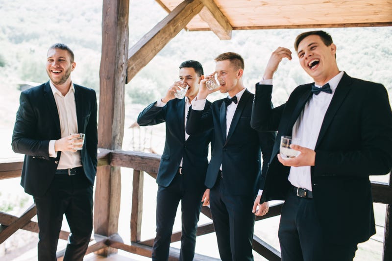 The groom and his friends celebrate the wedding