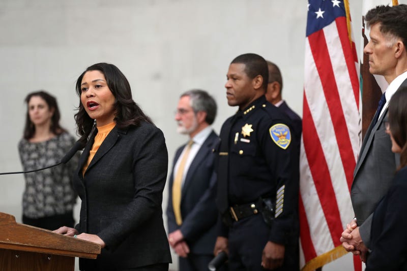 : San Francisco Mayor London Breed (L) speaks during a press conference as San Francisco police chief William Scott (R) looks on at San Francisco City Hall on March 16, 2020 in San Francisco, California.