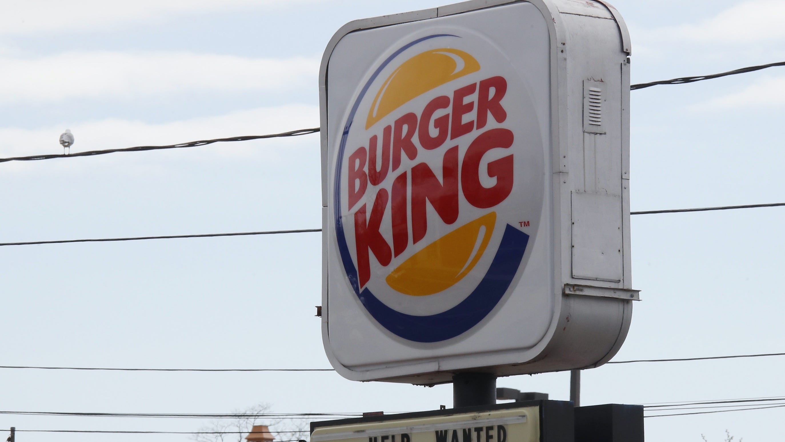 PHOTOS: Burger King sign collapses, crushes minivan in Richmond