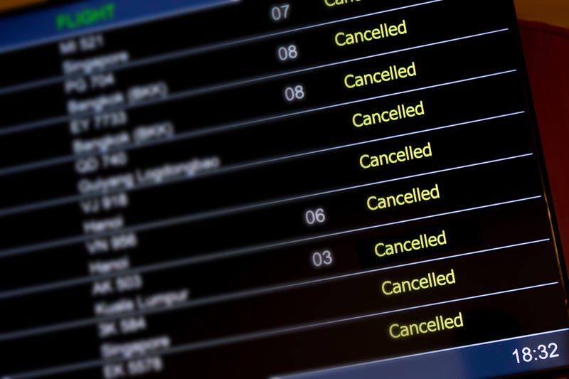Airport billboard panel with cancelled flights.