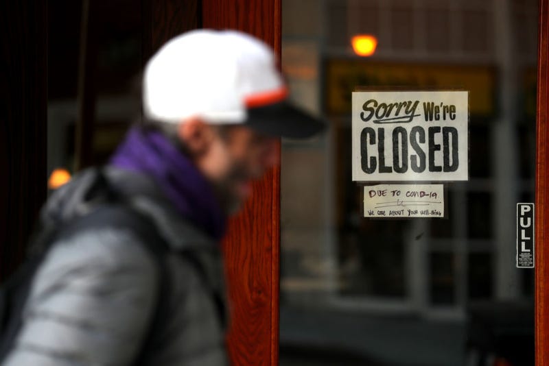 A pedestrian walks by a closed sign on the door of a restaurant on March 17, 2020 in San Francisco, California. 