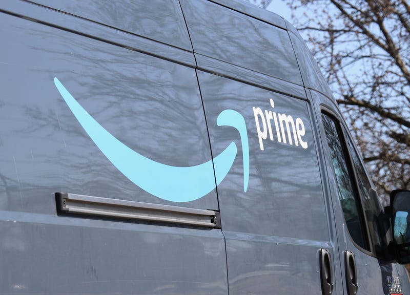 Products are seen on a conveyor belt at an Amazon fulfillment center