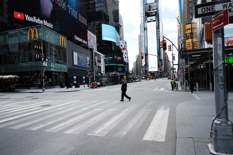 A man walks through a mostly empty Times Square on March 22, 2020, as the COVID-19 pandemic was beginning to grip the city. A new survey says the five boroughs have come a long way since then
