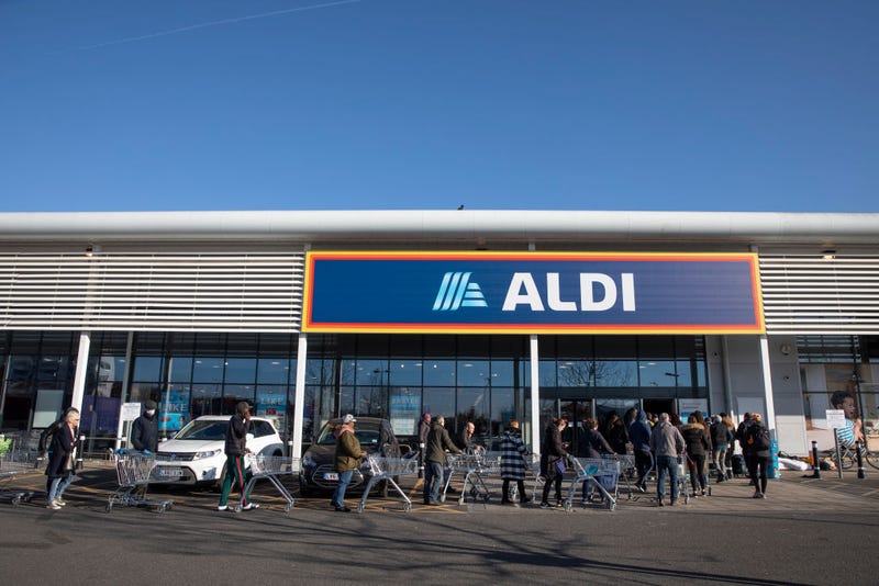 Shoppers queue outside an Aldi supermarket on March 23, 2020 in London, England. Coronavirus (COVID-19) pandemic has spread to at least 182 countries, claiming over 10,000 lives and infecting hundreds of thousands more.