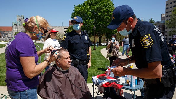 Judge dismisses charges against 6 hair stylists at Michigan Capitol protest